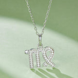 Virgo pendant necklace with pavé crystals and green enamel, detailed clasp and bail