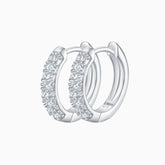 Half pavé moissanite huggie hoops in white gold vermeil, with sparkling stone half-moon design