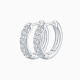 Half pavé moissanite huggie hoops in white gold vermeil, with sparkling stone half-moon design