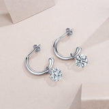 Pair of hinged chunky hoop earrings with round moissanite drops, white gold vermeil
