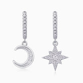 Asymmetric moon and star drop earrings in white gold vermeil with pavé detailing