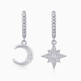 Asymmetric moon and star drop earrings in white gold vermeil with pavé detailing