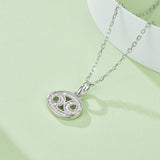 Cancer symbol moissanite pendant, oval setting with green centers and glittering pave