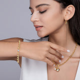 Yellow gold vermeil bracelet with round moissanite stone and bead links, toggle clasp