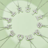 Zodiac moissanite pendant necklaces on chains, including a Sagittarius charm