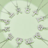 Zodiac pendant necklace assortment; one Libra charm with stone-studded design