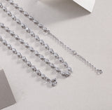 Tennis necklace clasp view with round bezel-set stones, white gold vermeil chain