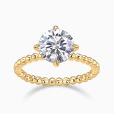 Yellow gold plated solitaire engagement ring with round moissanite center and beaded band