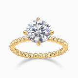 Yellow gold plated solitaire engagement ring with round moissanite center and beaded band