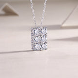 Openwork 6-stone moissanite cluster pendant, side view, white gold vermeil
