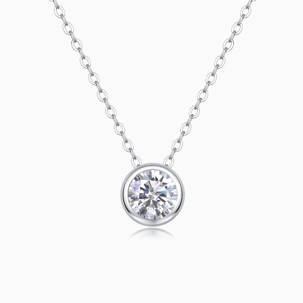 Round bezel-set moissanite solitaire pendant necklace on a silver-tone chain
