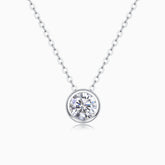 Round bezel-set moissanite solitaire pendant necklace on a silver-tone chain