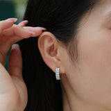 Huggie hoop on ear: double-row clear moissanite pavé, white-gold vermeil finish