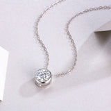 Round moissanite solitaire pendant in bezel with chain links, white gold vermeil look