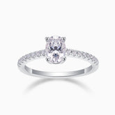 Oval-cut pavé moissanite engagement ring with split prong setting, sparkling stones on band