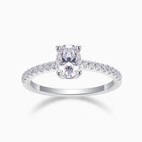 Oval-cut pavé moissanite engagement ring with split prong setting, sparkling stones on band