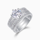 Angled view of 3-piece stackable rings: round center moissanite with pavé sides
