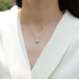 Moissanite solitaire pendant necklace with round stone in bezel on chain