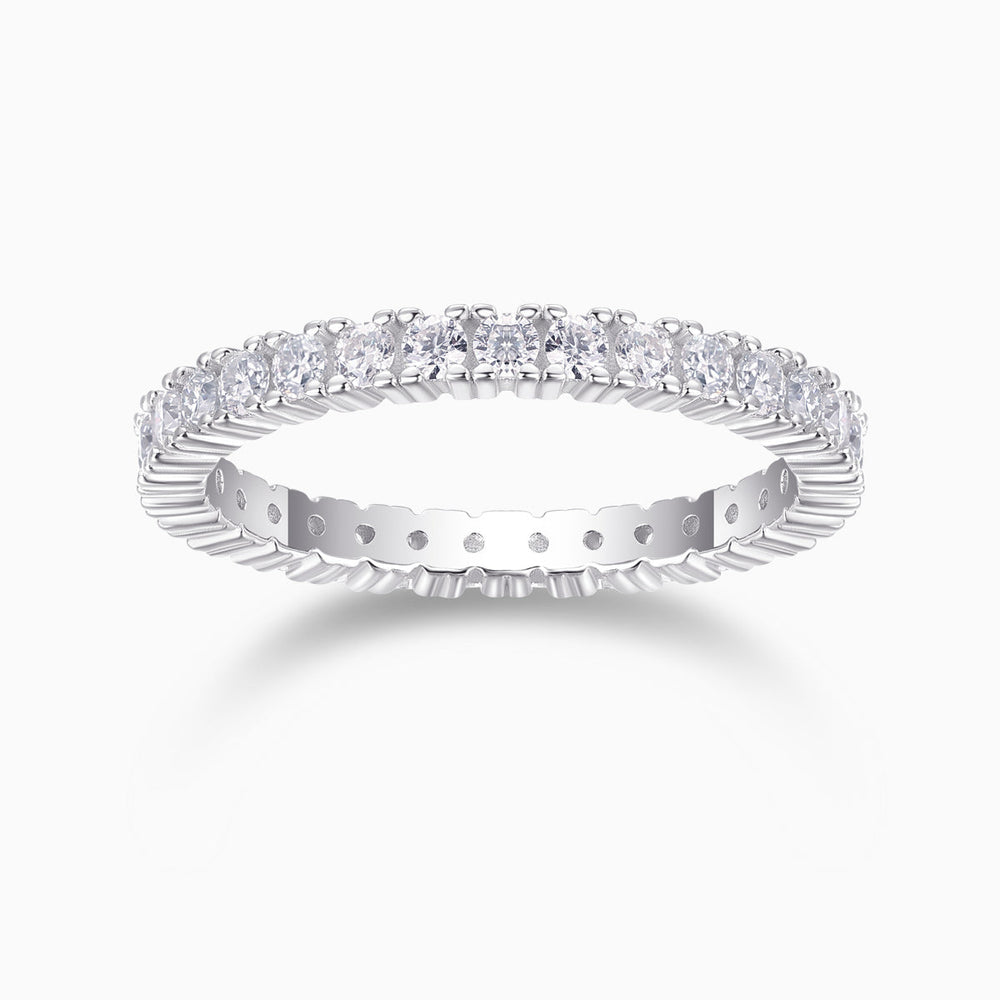 Minimalist moissanite pavé stacking ring in white metal with oval stones along the band