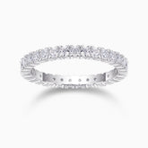 Minimalist moissanite pavé stacking ring in white metal with oval stones along the band