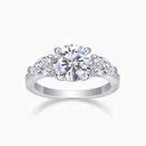 Three-stone moissanite engagement ring, white gold-plated band with round center and side stones
