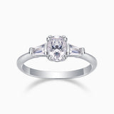 Three-stone oval moissanite ring in white gold, central oval with side baguettes
