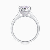 White gold vermeil pear-cut solitaire moissanite ring, angled view of prongs and gallery