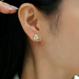 Christmas tree stud earrings on ear, white gold vermeil with round moissanite stones