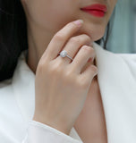 Oval Moissanite pavé ring on hand, white gold vermeil setting