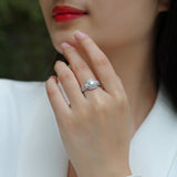 Moissanite square double-halo ring on hand, pavé outer detail