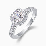 Angled view of cushion halo pavé moissanite engagement ring, bezel halo and pavé sides