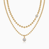 Double-layer beaded necklace set with round blue gem pendant, yellow gold vermeil