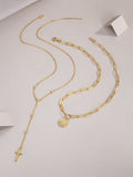 Layered lariat necklace set with coin medallion and dangling cross, blue stones