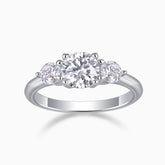 Three-stone round moissanite engagement ring in white gold vermeil with center and side stones
