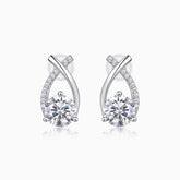 Moissanite stud earrings in white gold vermeil, pear teardrop with ribbon pavé detailing