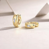 Chunky huggie hoop earrings, yellow gold vermeil; visible clasp and marquise stone