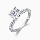 Round twist moissanite engagement ring angled view, round center with twisted prong setting