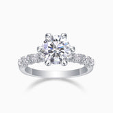 Six-prong pavé moissanite engagement ring with round center stone, white metal band