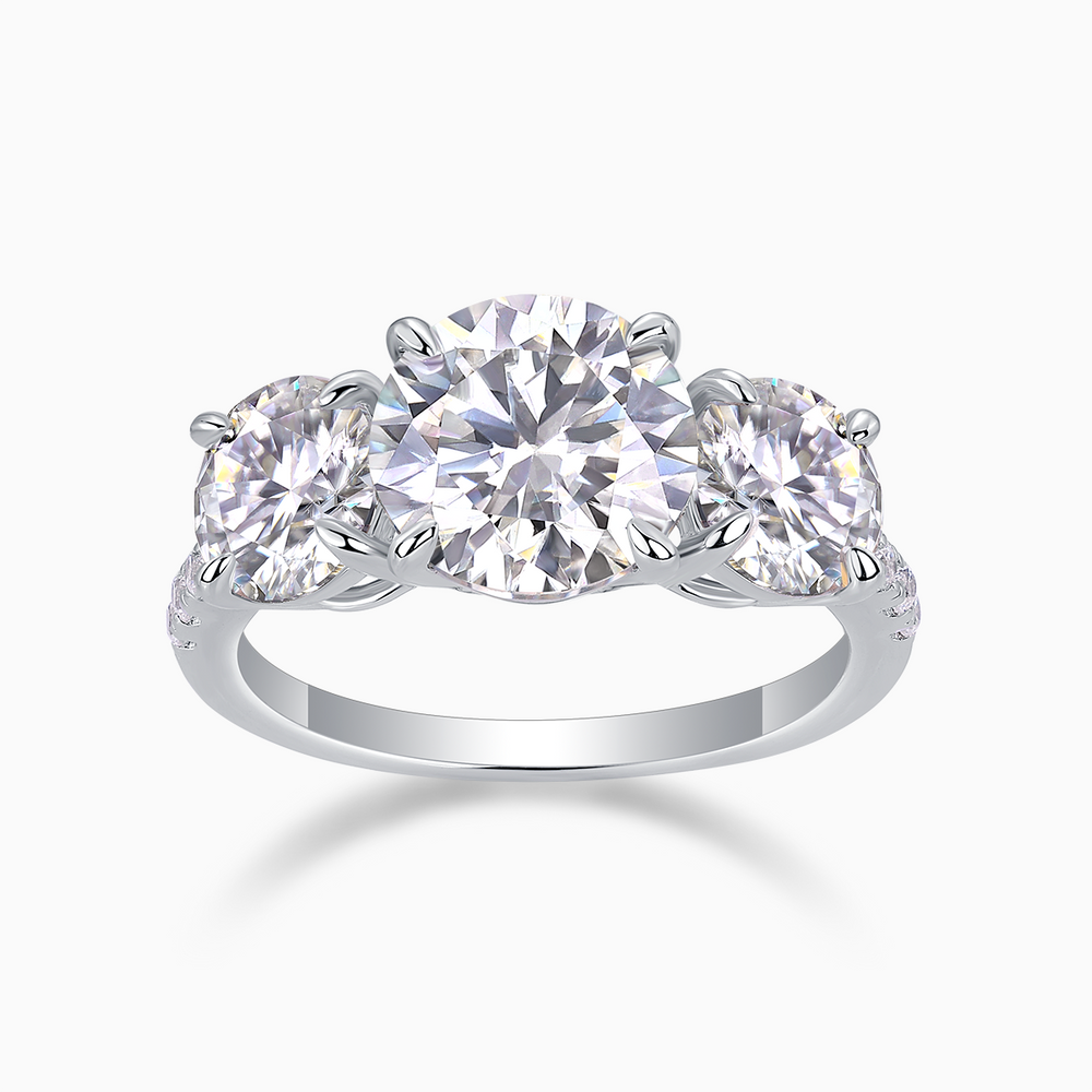 Three-round moissanite engagement ring with three round stones and white gold-plated band