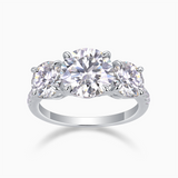 Three-round moissanite engagement ring with three round stones and white gold-plated band