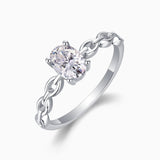 Oval moissanite engagement ring with chain link band, oval center stone front view