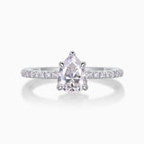 Pear cut moissanite engagement ring with pavé band and four-prong pear setting