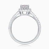 Underside view of emerald-cut halo ring with twisted pavé shank, white metal