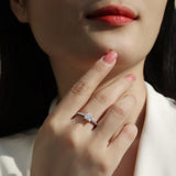Princess-cut moissanite pavé ring on hand, white-gold vermeil band