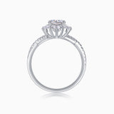 Top view of round halo engagement ring with cathedral prongs and pavé shank