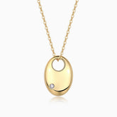 Oval dome pendant necklace with round moissanite accent; yellow gold vermeil chain
