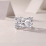 Crossover moissanite band, multi-row pavé with crisscross front profile