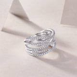 Crisscross moissanite crossover band with three pavé rows, side view