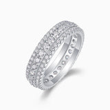 Moissanite pavé eternity ring angled view, smooth band with raised stone prongs