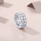 Side view of double-row moissanite eternity band with bezel-set stones